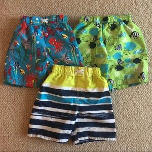 3 pairs size 3T swim trunks.